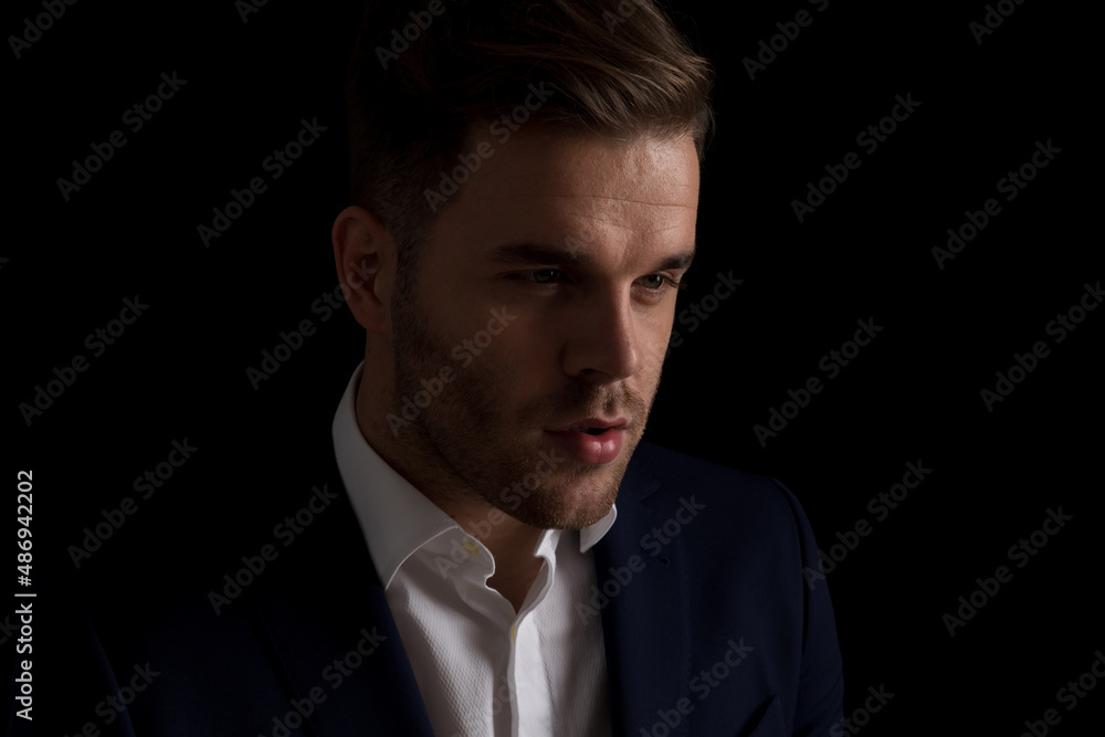 portrait of handsome young guy looking to side in a close up view