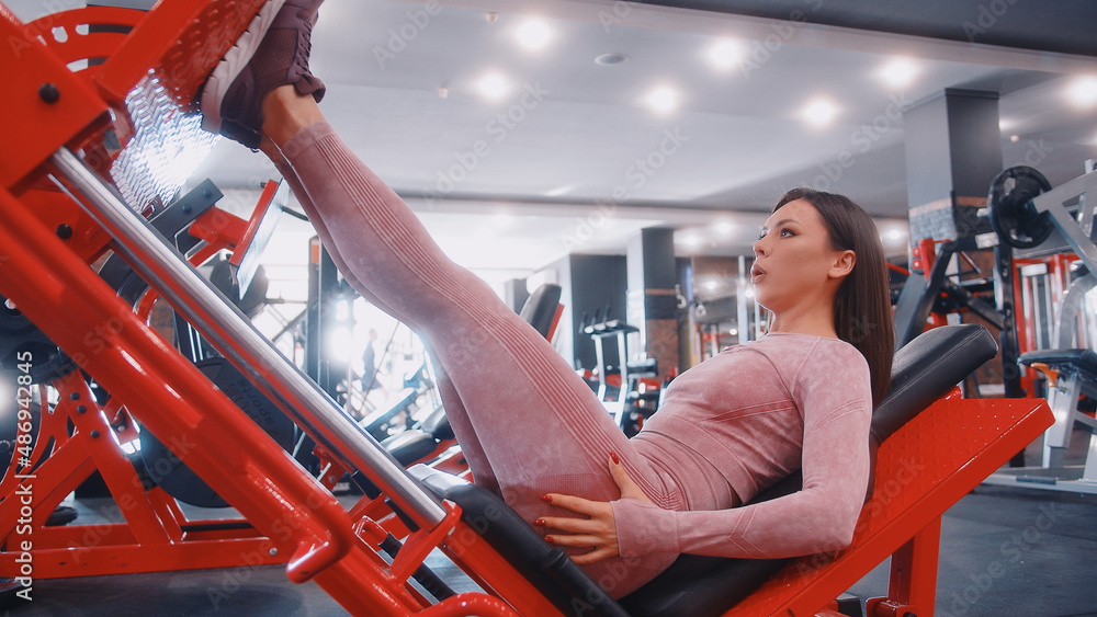 young woman doing exercises in the gym