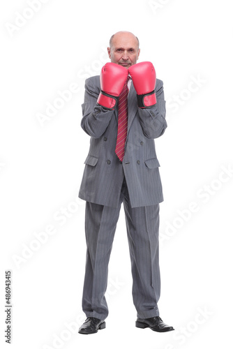 Businessman with boxing gloves on with camera focus on the man