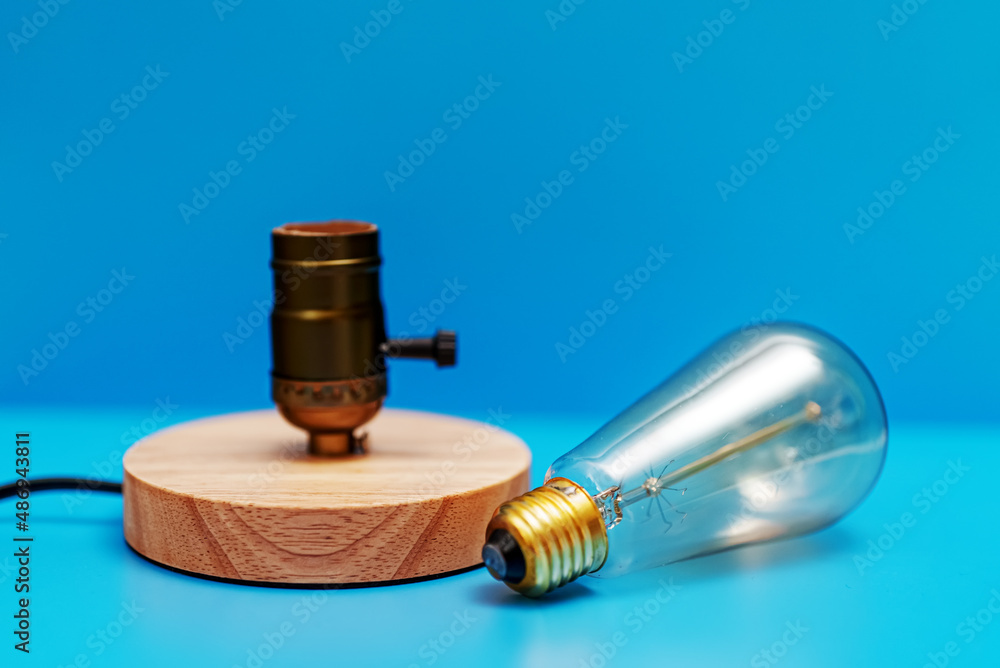 Lamp near socket. Energy saving concept. Lamp near socket. Energy saving concept.