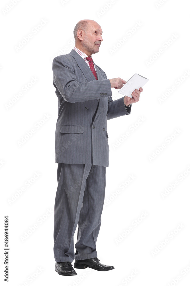 Side view of mature tradesman using tablet computer Side view of mature tradesman using tablet computer