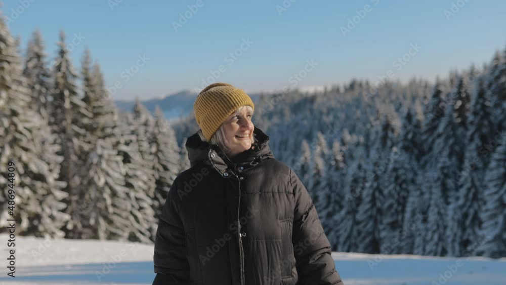 Portrait of a Young beautiful Woman having Fun and Making Faces, Looking at Camera and Being Funny, Smiling, Enjoying a Sunny Winter Day at Mountain on a Snowy Forest in top of the Ski Slope, 4k Portrait of a Young beautiful Woman having Fun and Making Faces, Looking at Camera and Being Funny, Smiling, Enjoying a Sunny Winter Day at Mountain on a Snowy Forest in top of the Ski Slope, 4k