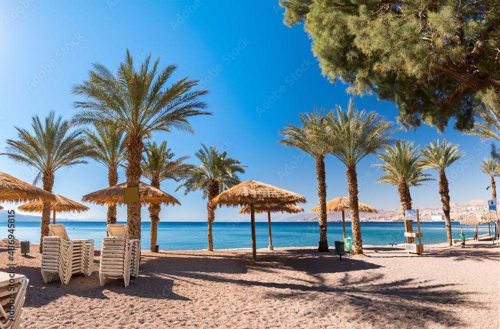 Morning on sandy beach in Eilat - famous tourist resort and recreation city in Israel