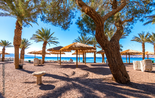 Fototapeta Naklejka Na Ścianę i Meble -  Morning on sandy beach in Eilat - famous tourist resort and recreation city in Israel