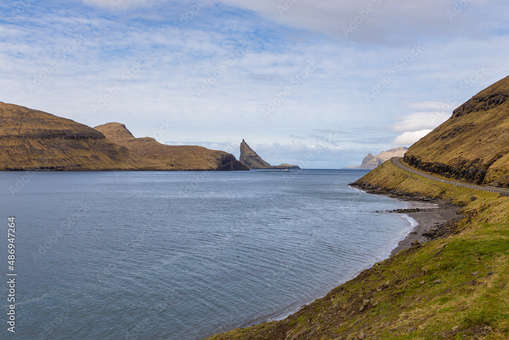 View of the road along the coast on the island of Vagar, Bour, Faroe islands.