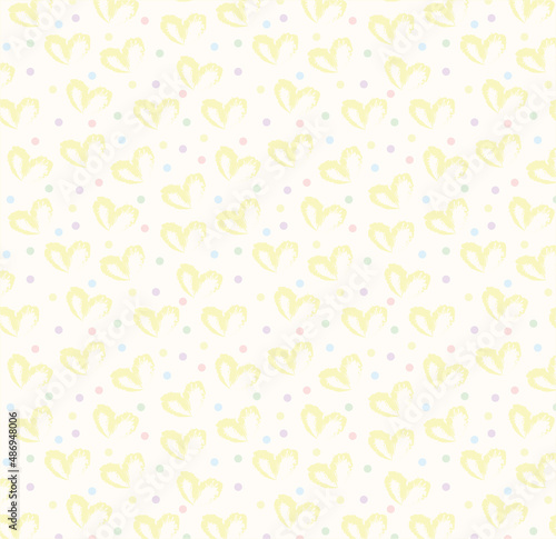 Seamless pattern of hand drawn hearts in yellow on beige and neutral background with colored dots in pastel rainbow colors