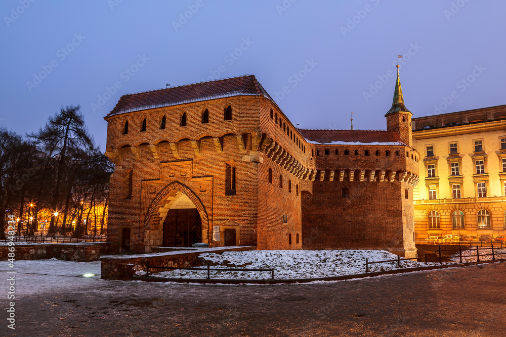 Defensive tower of the Barbican in winter evening is the gate of the medieval Krakow, Poland