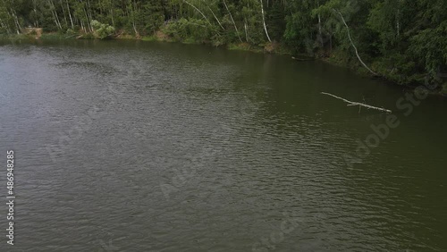 Russia, Volga, 07.08.2021. People in a boat float on the river in sunny weather, aerial video. Water recreation concept. editorial use only.
