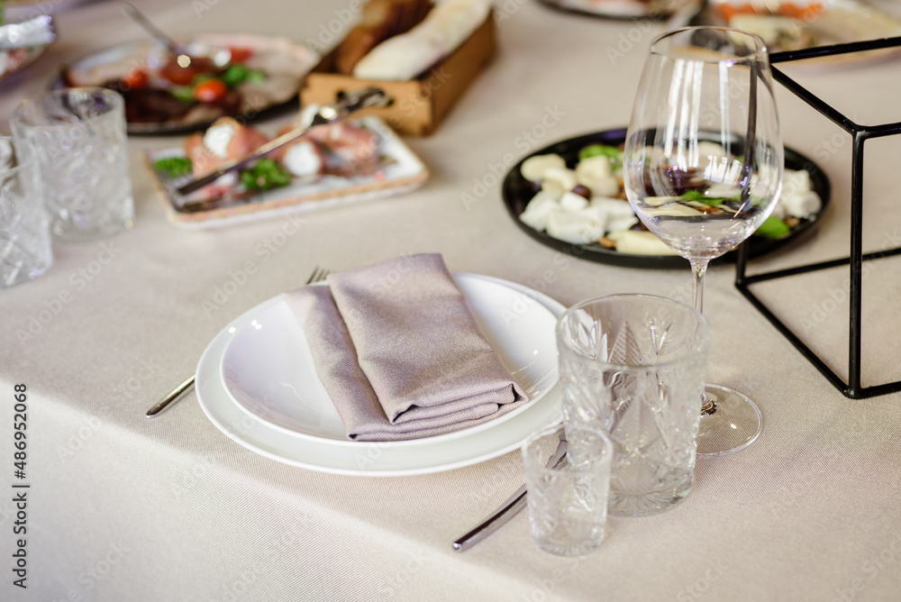 Сatering table with glass stemware at restaurant before party Сatering table with glass stemware at restaurant before party