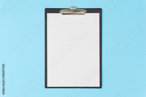 A tablet with a blank page on a blue background. Medical diagnosis or a mock-up of a doctor's prescription.