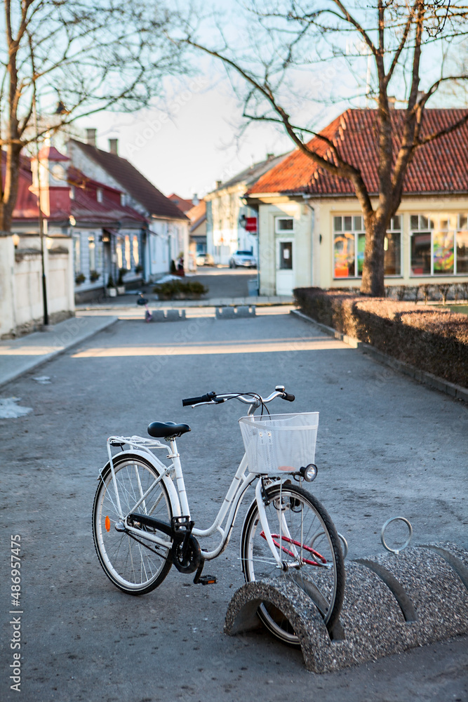 Bicycle parking station with bike is in the Kuressaare town at spring season, Estonia, vertical image