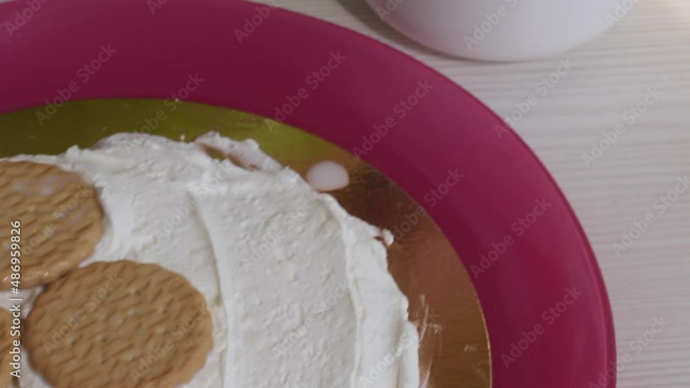 The ingredients for the cake are laid out on the table. Cake with savoiardi cookies and marshmallow roses. Close-up The ingredients for the cake are laid out on the table. Cake with savoiardi cookies and marshmallow roses. Close-up