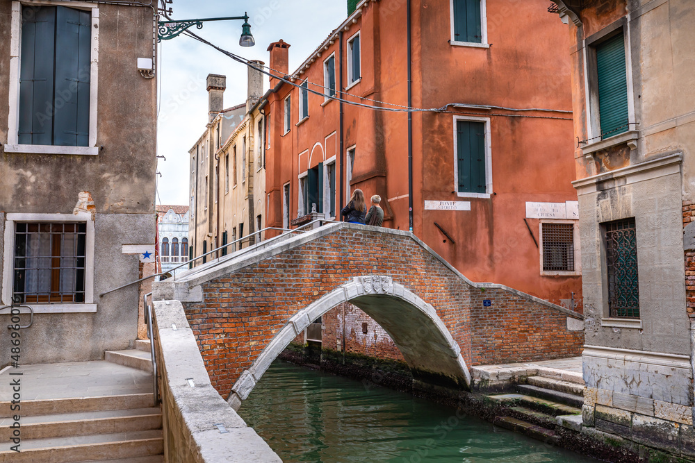 Historic bridge and canal houses in Venice, Italy