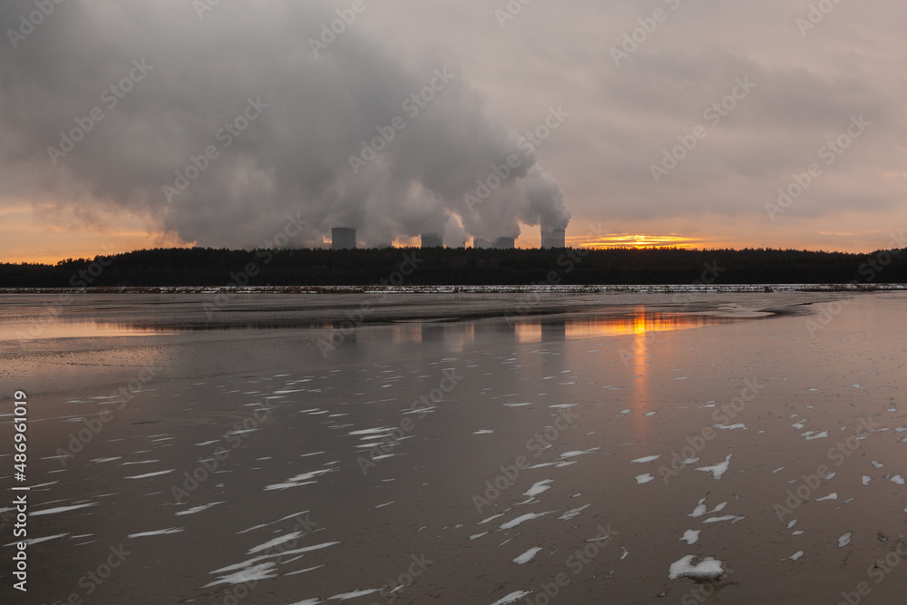Winter power plant at sunset