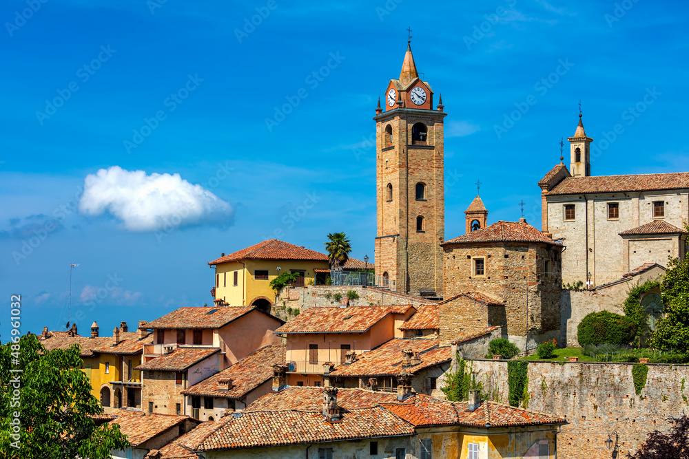 Old town of Monforte d'Alba under blue sky in Italy.