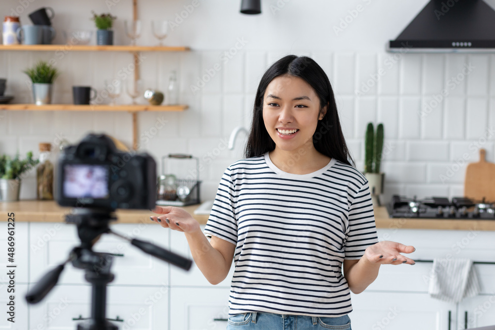 Asia vlogger, freelancer or entrepreneur filming a video, work at home studio or office. Online sales Asia vlogger, freelancer or entrepreneur filming a video, work at home studio or office. Online sales