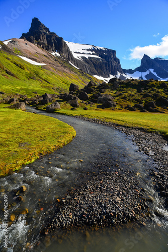 The boulders, peaks and crystal clear rivers of the idyllic Stórurð valley, East Fjords, Iceland