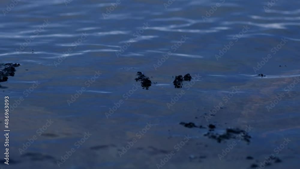 The dark Baltic Sea with a large block of ice creates a beautiful formation of water The dark Baltic Sea with a large block of ice creates a beautiful formation of water
