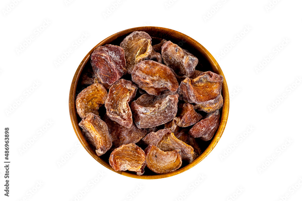 Traditional Japanese hoshigaki dried persimmon fruit snack slices in the round wooden bowl isolated on white background top view. Traditional Japanese hoshigaki dried persimmon fruit snack slices in the round wooden bowl isolated on white background top view.