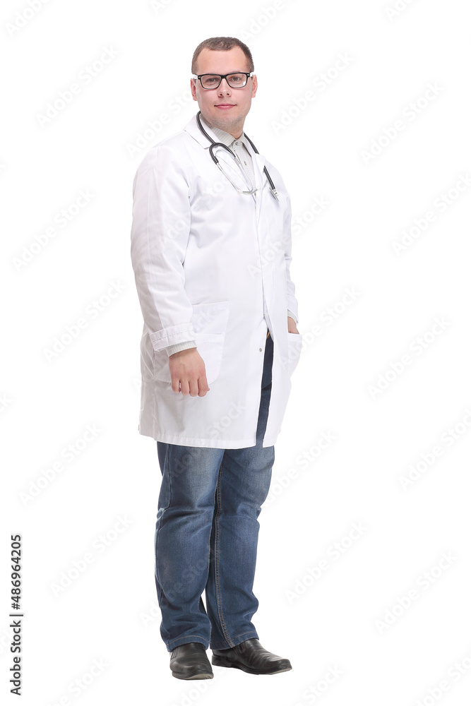 smiling young male doctor with stethoscope over neck in medical coat smiling young male doctor with stethoscope over neck in medical coat