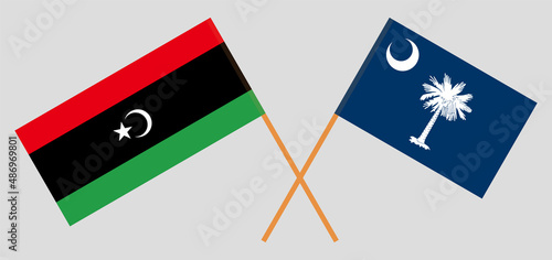 Crossed flags of Libya and The State of South Carolina. Official colors. Correct proportion