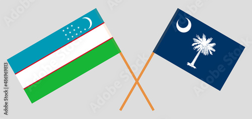 Crossed flags of Uzbekistan and The State of South Carolina. Official colors. Correct proportion