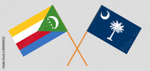 Crossed flags of the Comoros and The State of South Carolina. Official colors. Correct proportion