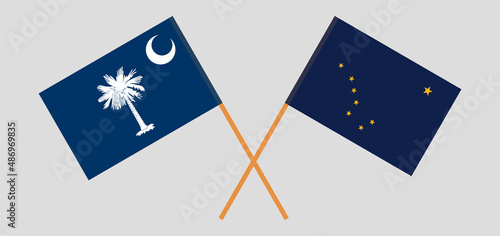 Crossed flags of The State of South Carolina and the State of Alaska. Official colors. Correct proportion