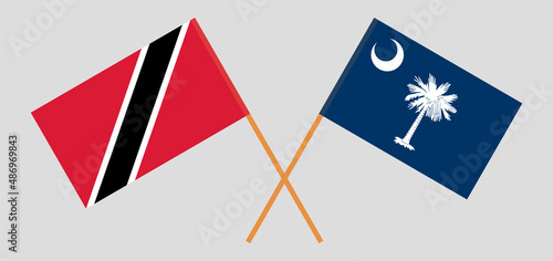 Crossed flags of Trinidad and Tobago and The State of South Carolina. Official colors. Correct proportion
