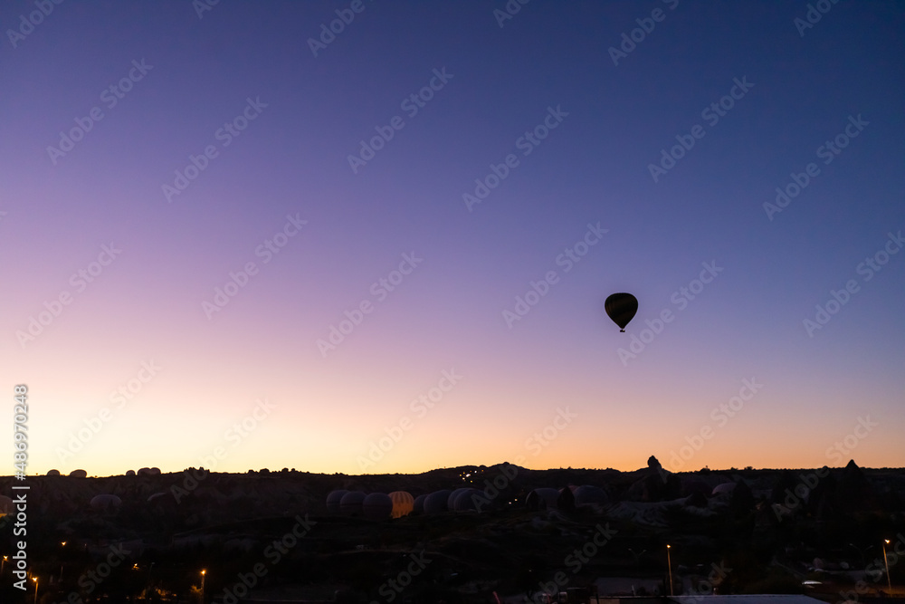 Balloons taking off at sunrise in Cappadocia Balloons taking off at sunrise in Cappadocia