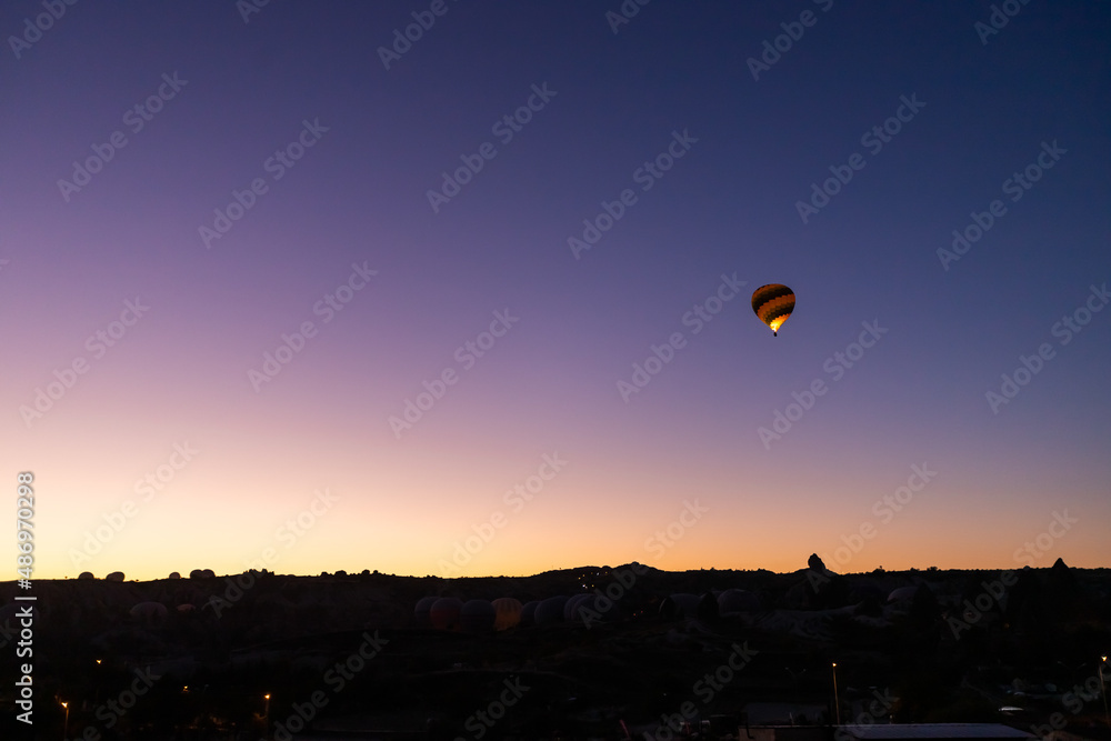Balloons taking off at sunrise in Cappadocia Balloons taking off at sunrise in Cappadocia