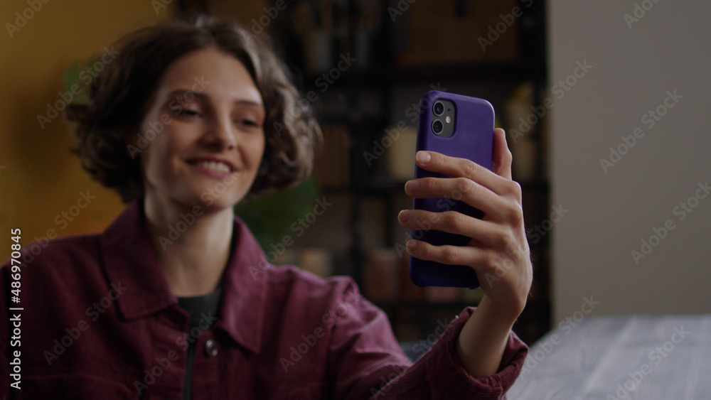 A young lady is talking with someone on the phone A young lady is talking with someone on the phone
