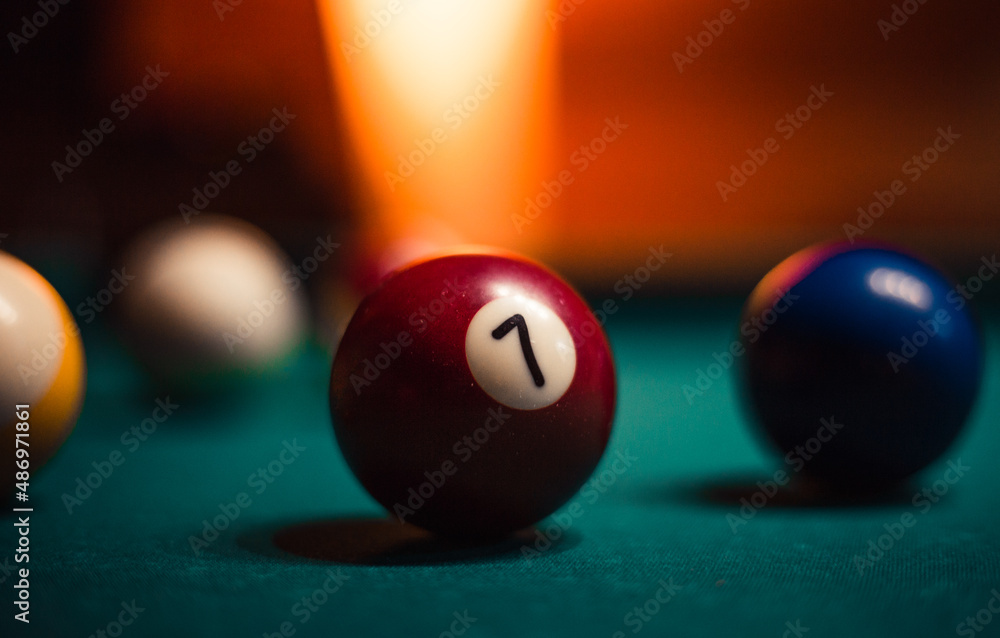 Detailed photo of pool (billiard) balls on cozy warm backround with orange lighting. Close up image of colorful billiard balls. Detailed photo of pool (billiard) balls on cozy warm backround with orange lighting. Close up image of colorful billiard balls.
