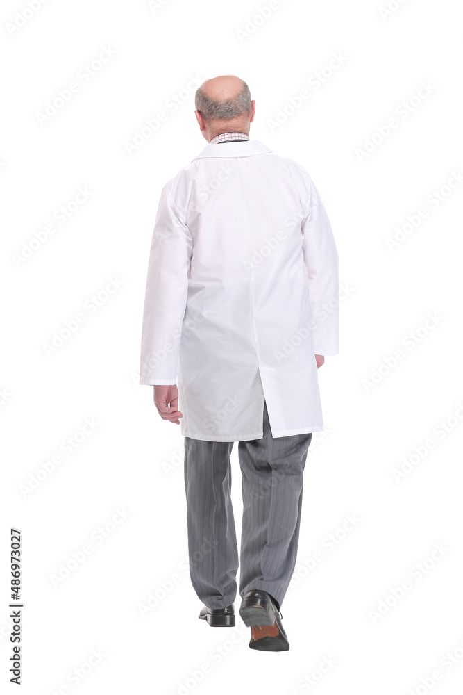 Back view of senior doctor walking on white background