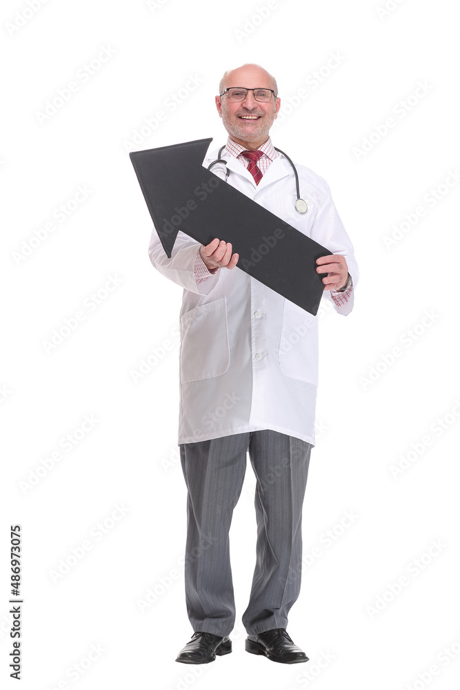 Mature doctor holding a black arrow pointing right isolated on white background Mature doctor holding a black arrow pointing right isolated on white background