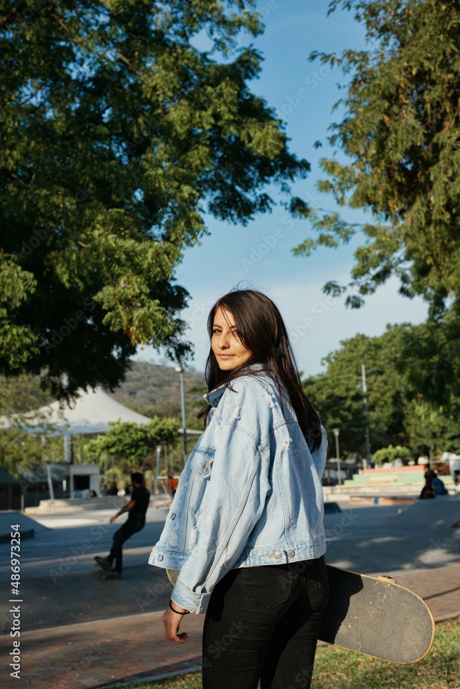 girl looking back at the skatepark girl looking back at the skatepark