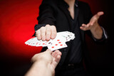 Card dealer shows fanned deck of playing cards. Your choose. POV - point of view. Red background.