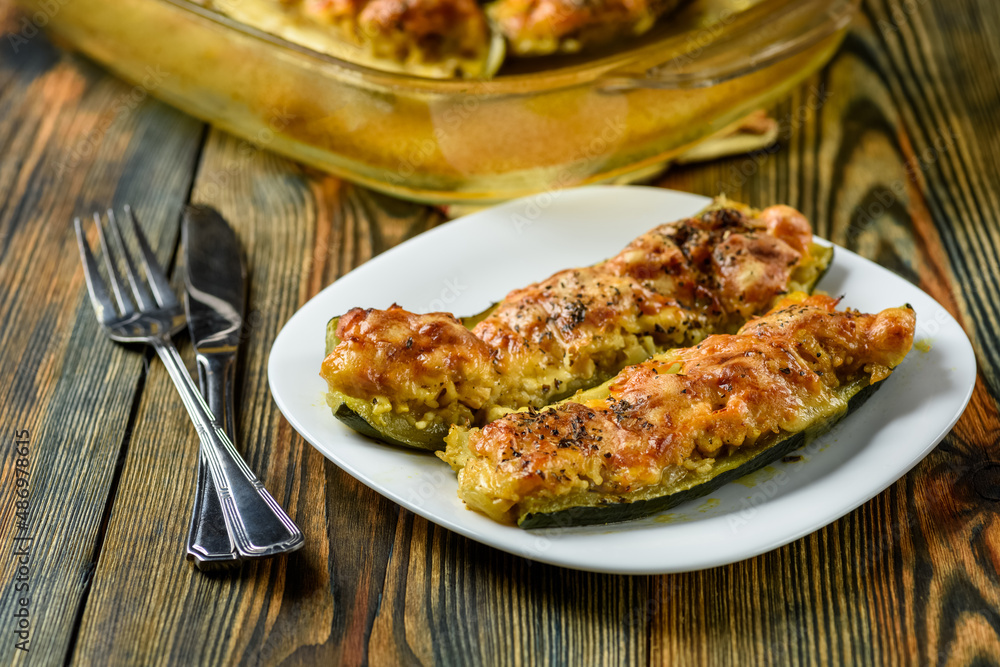 courgettes stuffed with chicken and baked with cheese courgettes stuffed with chicken and baked with cheese