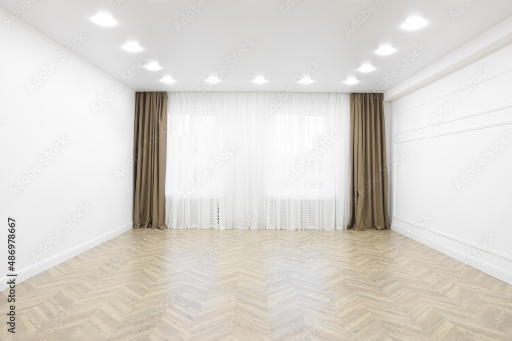 Empty room with white walls, large window and wooden floor Empty room with white walls, large window and wooden floor