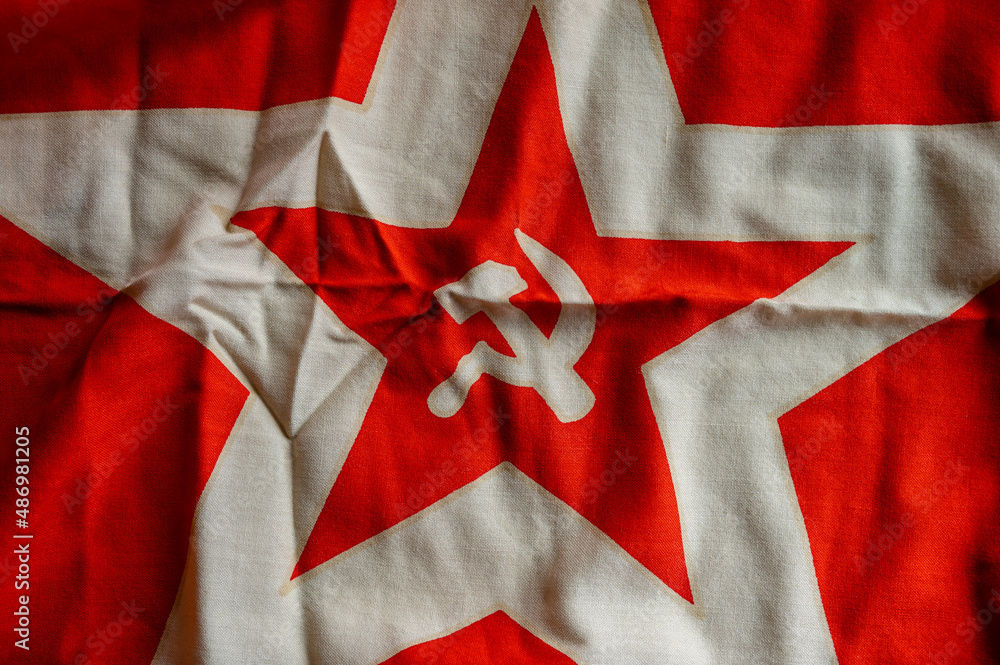 Communist flag with the hammer ants sickle.  - obrazy, fototapety, plakaty 