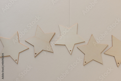 Fototapeta Naklejka Na Ścianę i Meble -  wooden stars on paper