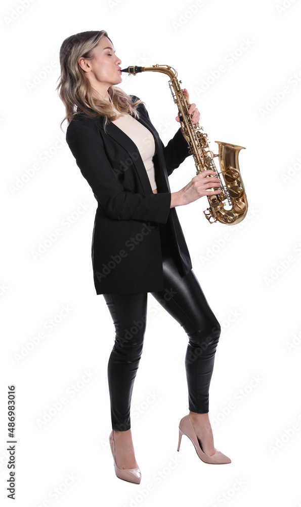 Naklejka premium Beautiful young woman in elegant suit playing saxophone on white background