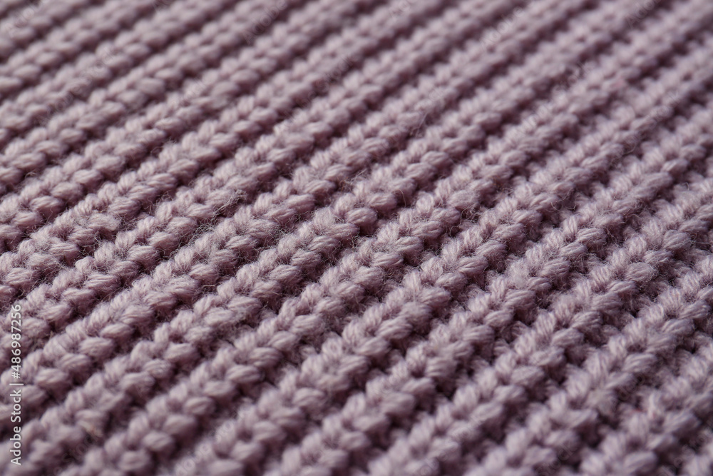 Beautiful violet knitted fabric as background, closeup