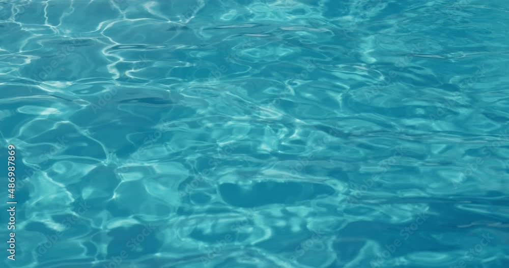 The surface of the water in the pool. The surface of the water in the pool.