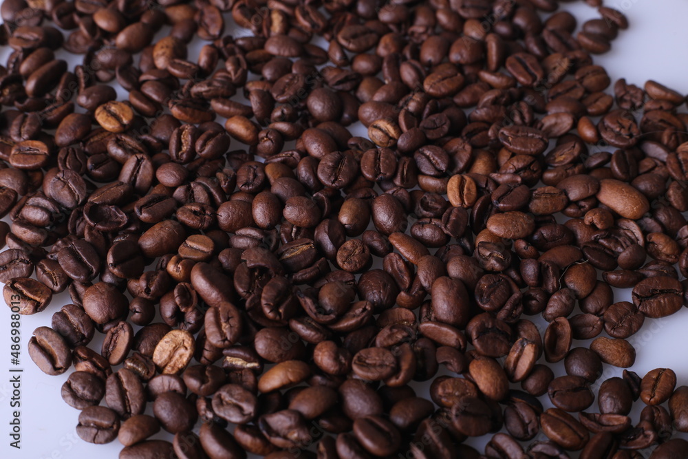 Coffee beans isolated on white background with copyspace for text. Coffee background or texture concept. Coffee beans isolated on white background with copyspace for text. Coffee background or texture concept.