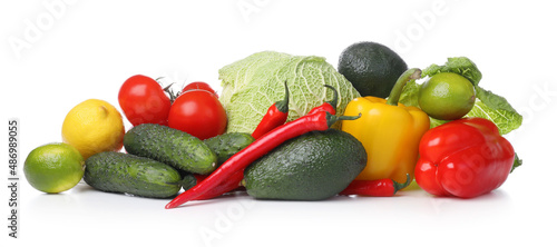Heap of fresh ripe vegetables and fruits on white background