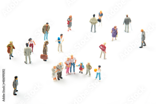 miniature people. different people communicate with each other on a white background