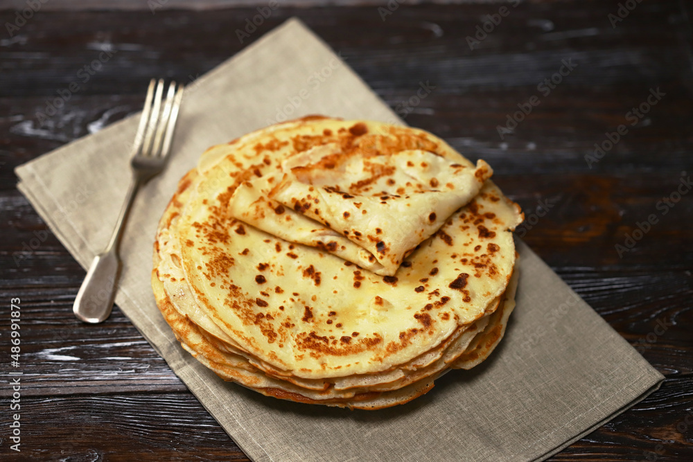 Selective focus. A stack of pancakes on a platter. Selective focus. A stack of pancakes on a platter.