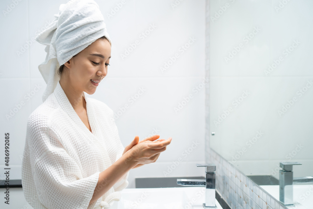 Asian beautiful woman putting smooth and skin care for facial soft. Asian beautiful woman putting smooth and skin care for facial soft.