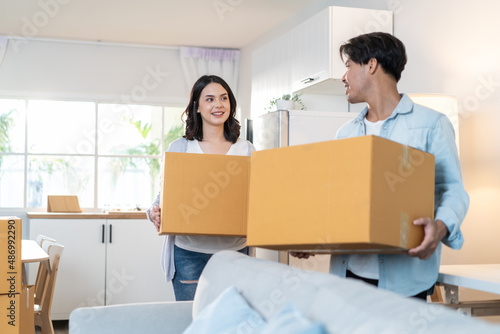 Asian young happy new marriage couple moving to new house together.